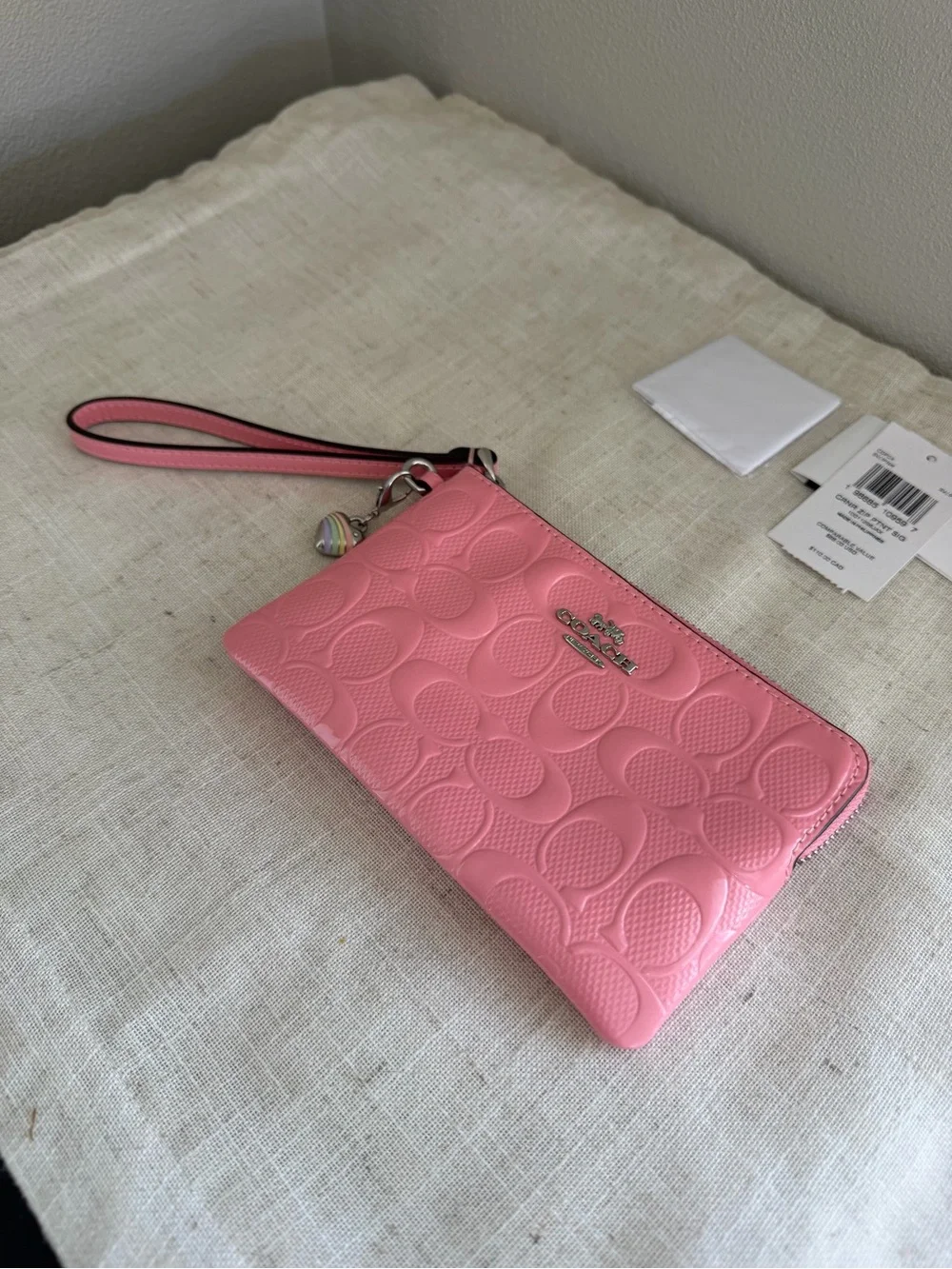 Coach Pink Corner Zip Signature Embossed Leather Wristlet with Heart Charm NWT